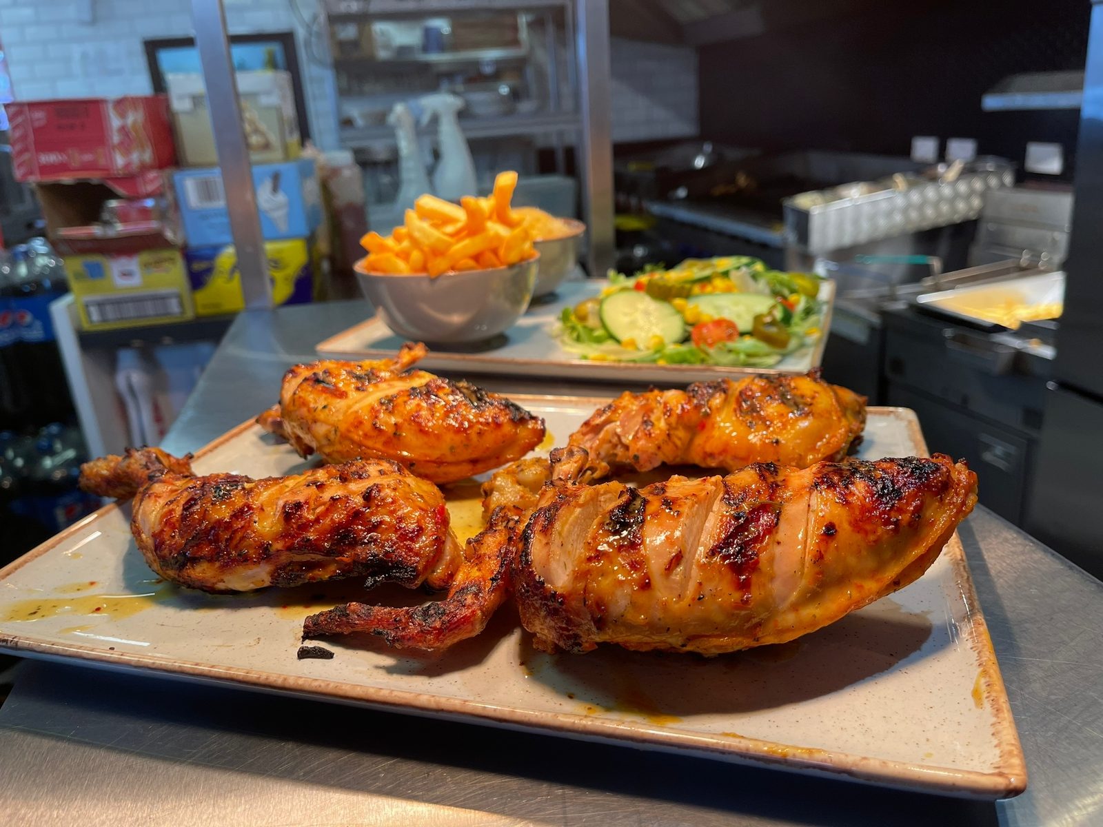 Grilled chicken platter with rice and salad at Moe's Hatfield