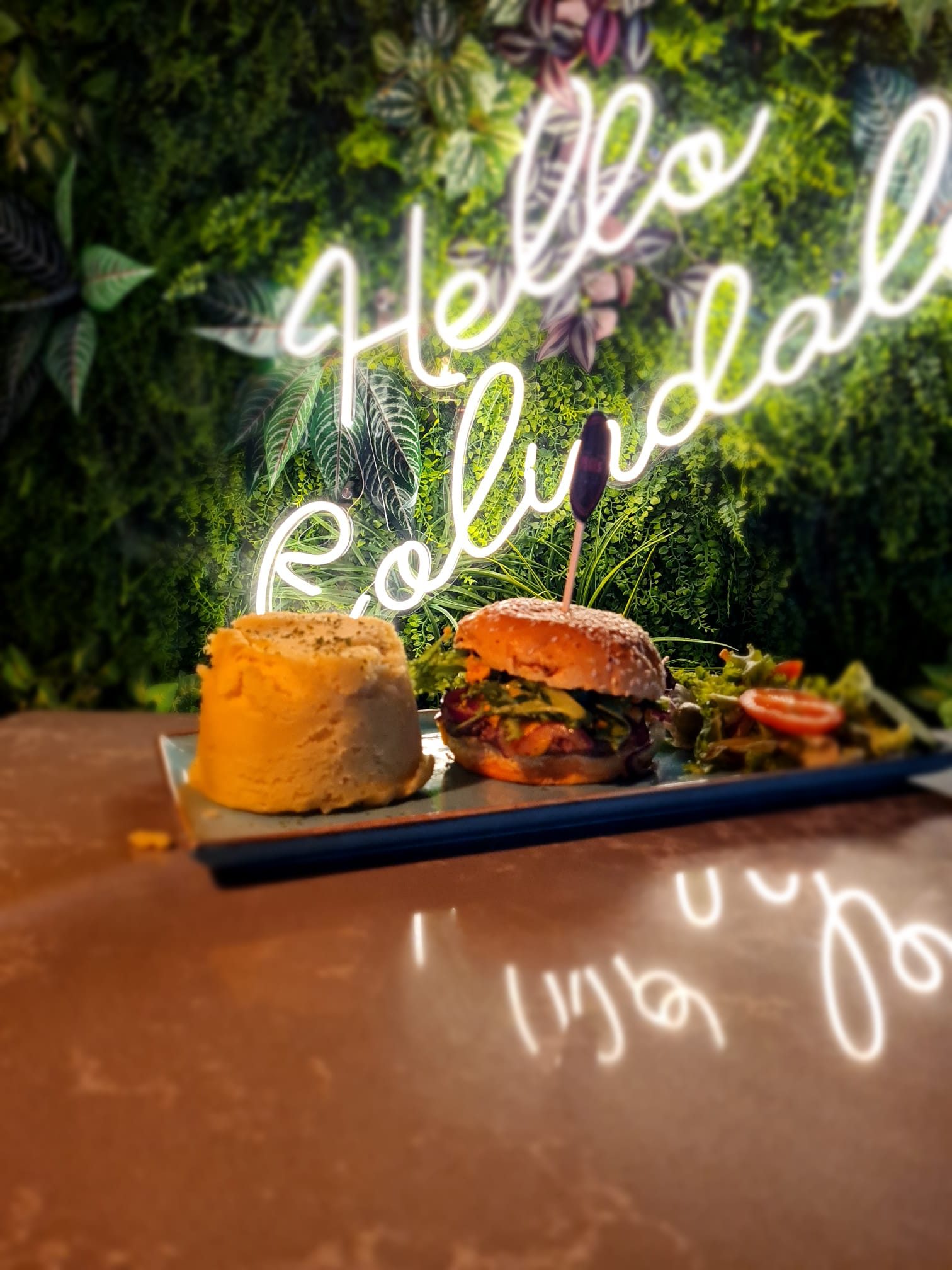 Hello Colindale neon sign above a burger at Moe's Colindale